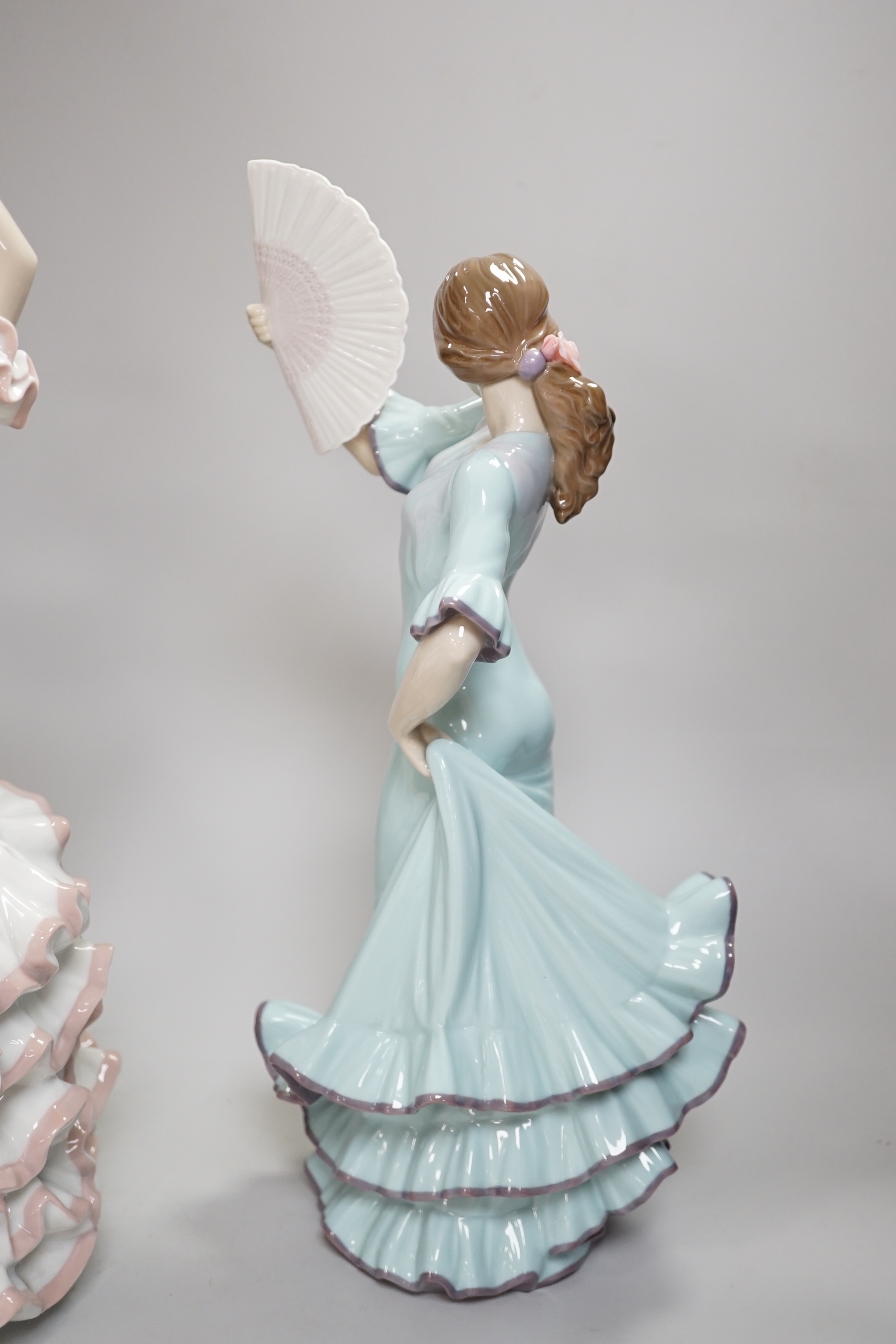 A Lladro centrepiece of two Spanish dancers, ‘A Passionate Dance’, boxed, together with another Lladro dancing figure with a fan, highest 43.5cm